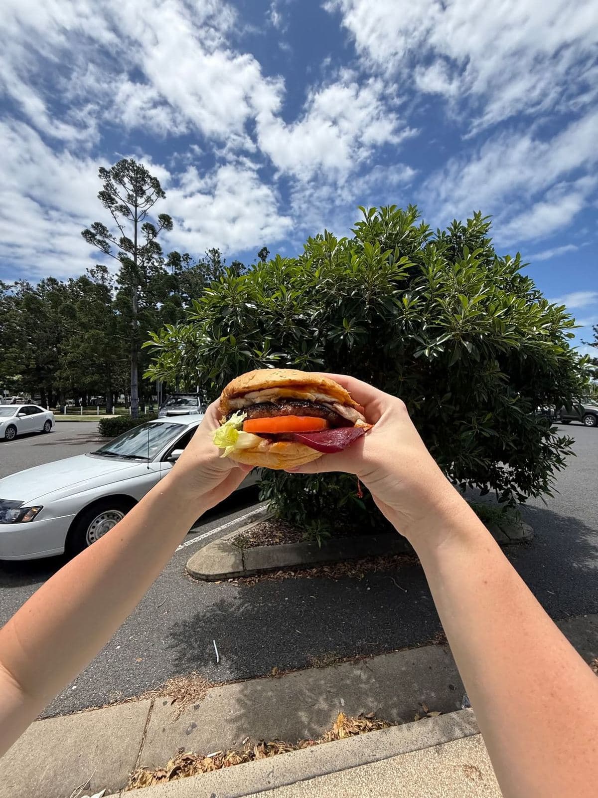 Holding up a fresh Parkside burger