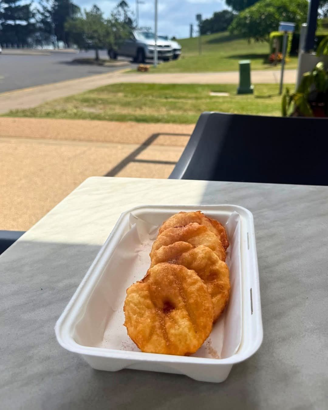 A box of pineapple fritters